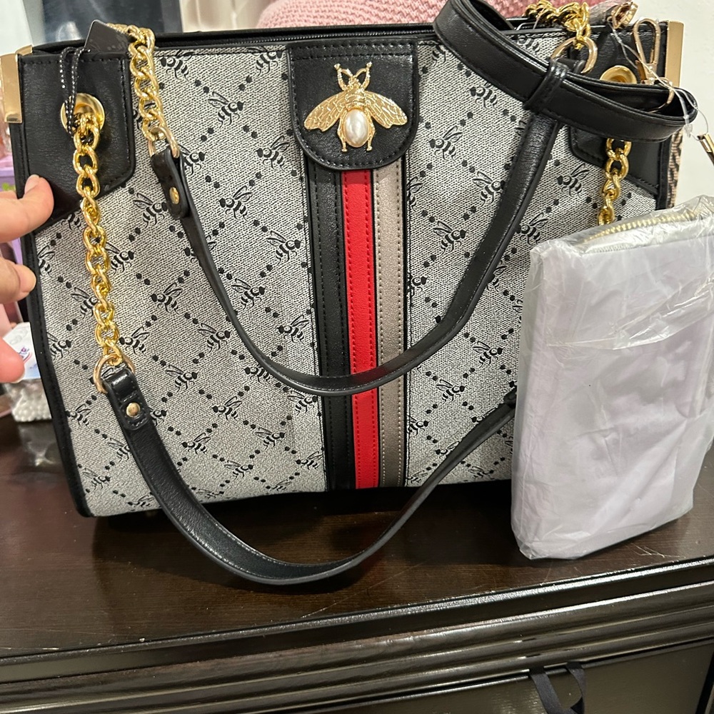 Chic Black and Red Shoulder Bag with Gold Accents